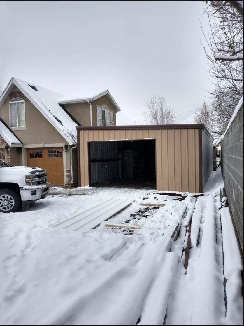 Detached steel garage build next to a home in Utah County UT